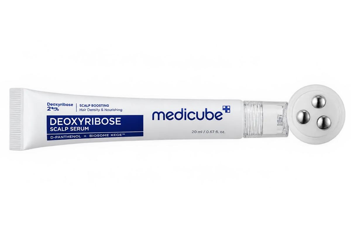 Serum tube beside its three steel massage balls