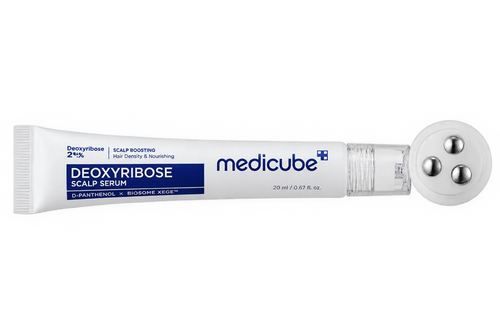 Serum tube beside its three steel massage balls